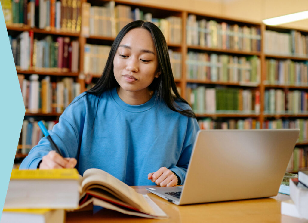 Woman studying in college library